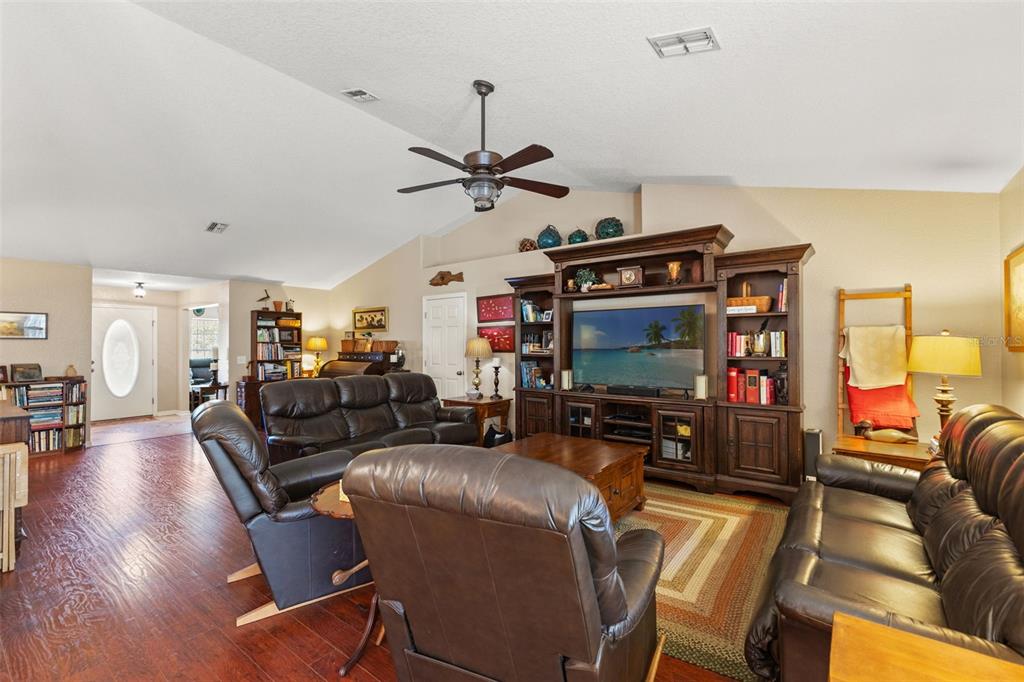 5 Boxleaf Court Homosassa, FL 34446 - Photo 13 of 58 a living room with furniture a flat screen tv and a ceiling fan