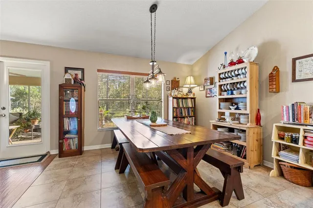 a kitchen with stainless steel appliances granite countertop a sink dishwasher and cabinets with wooden floor