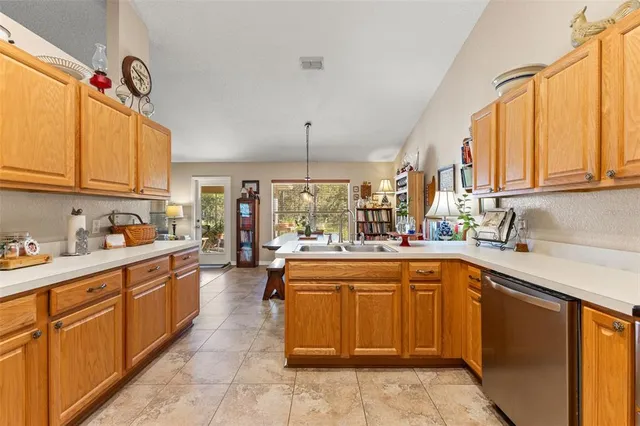 a kitchen that has a lot of cabinets in it and appliances