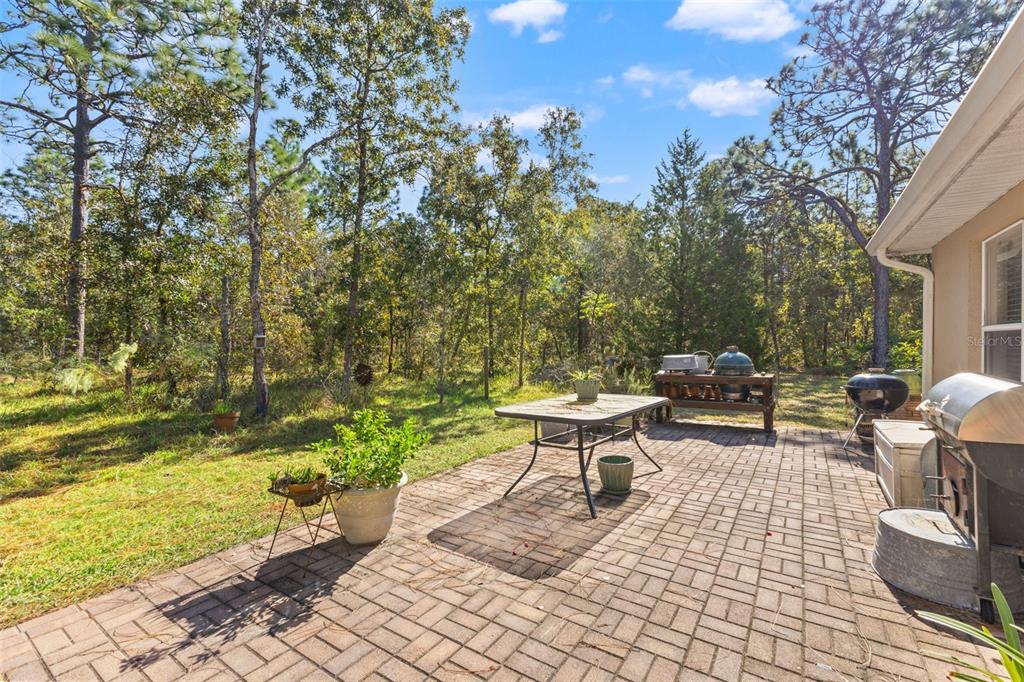 5 Boxleaf Court Homosassa, FL 34446 - Photo 27 of 58 a backyard of a house with outdoor seating