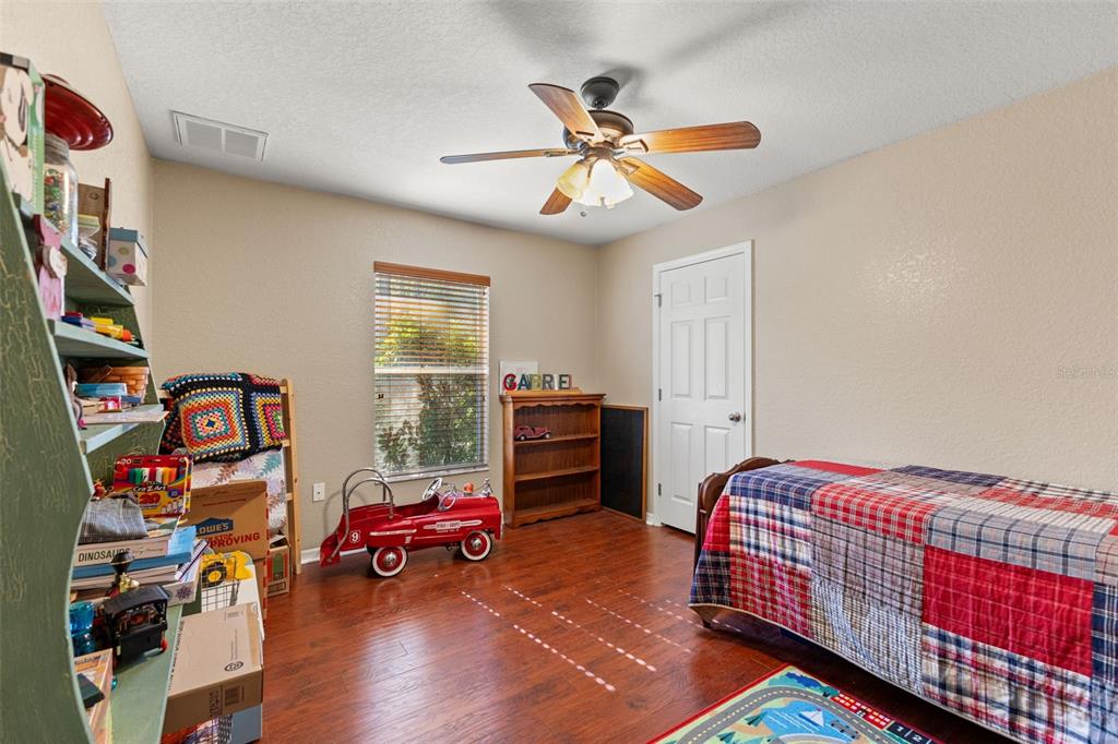 5 Boxleaf Court Homosassa, FL 34446 - Photo 34 of 58 a bedroom with furniture and a window