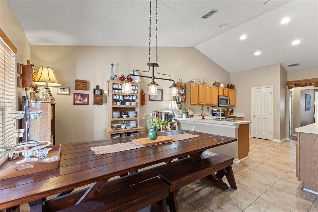5 Boxleaf Court Homosassa, FL 34446 - Photo 38 of 58 a room with stainless steel appliances kitchen island granite countertop furniture and a view of living room