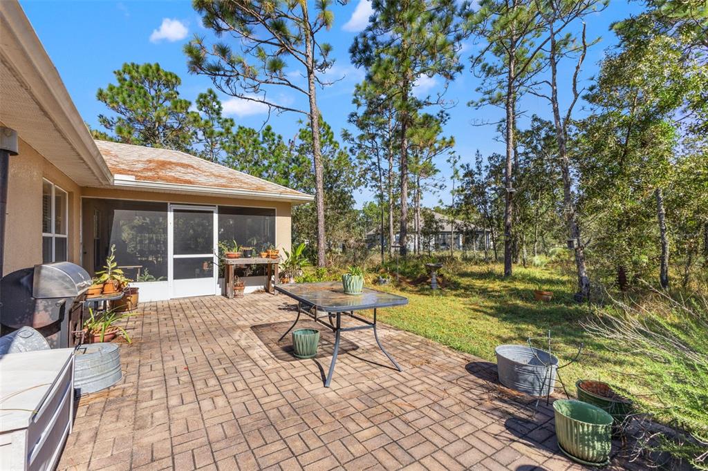 5 Boxleaf Court Homosassa, FL 34446 - Photo 40 of 58 a view of a house with backyard sitting area and garden