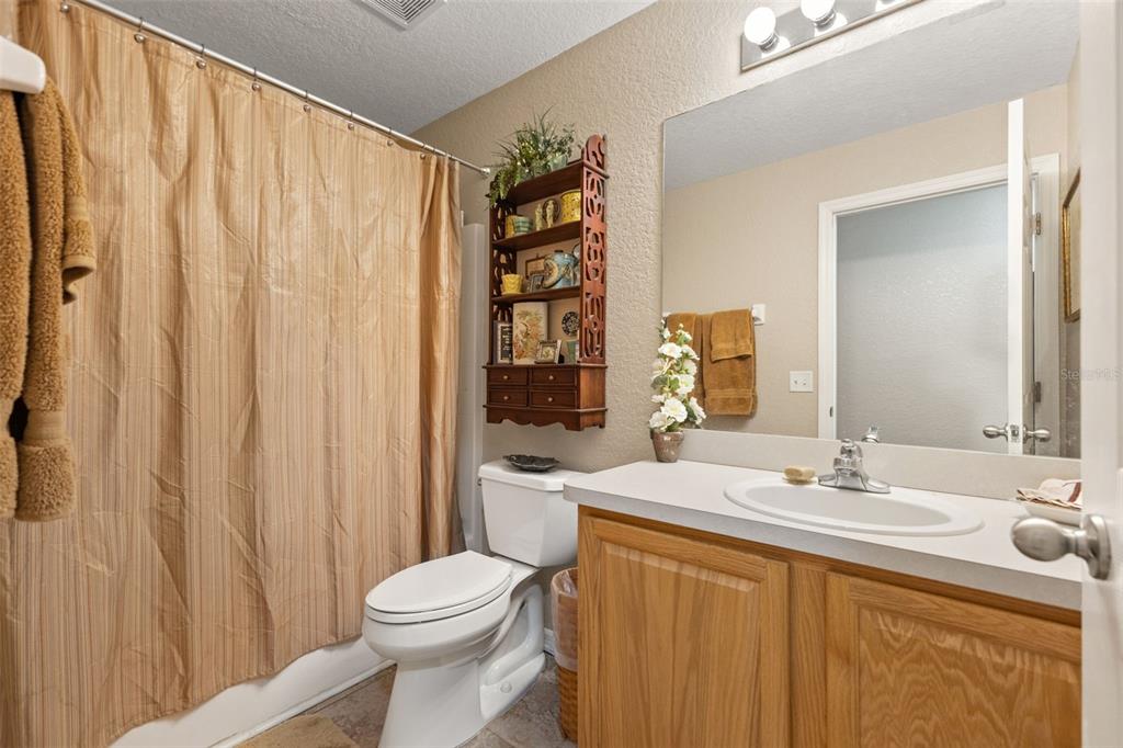 5 Boxleaf Court Homosassa, FL 34446 - Photo 41 of 58 a bathroom with a sink a toilet and shower curtain