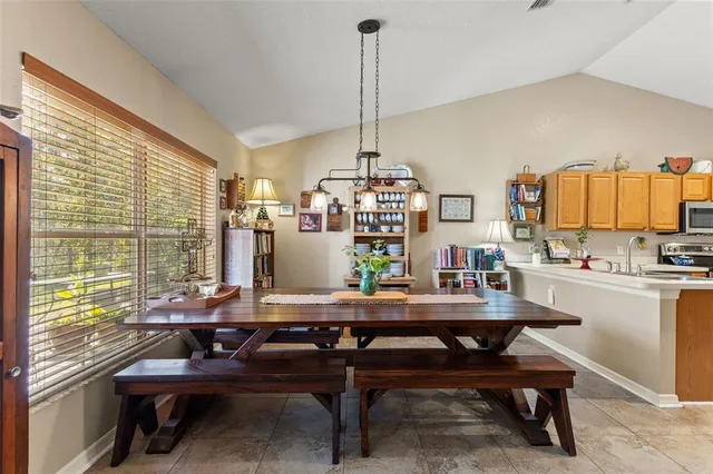 a living room with furniture a ceiling fan and a rug