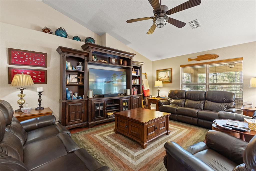 5 Boxleaf Court Homosassa, FL 34446 - Photo 9 of 58 a living room with furniture and a flat screen tv