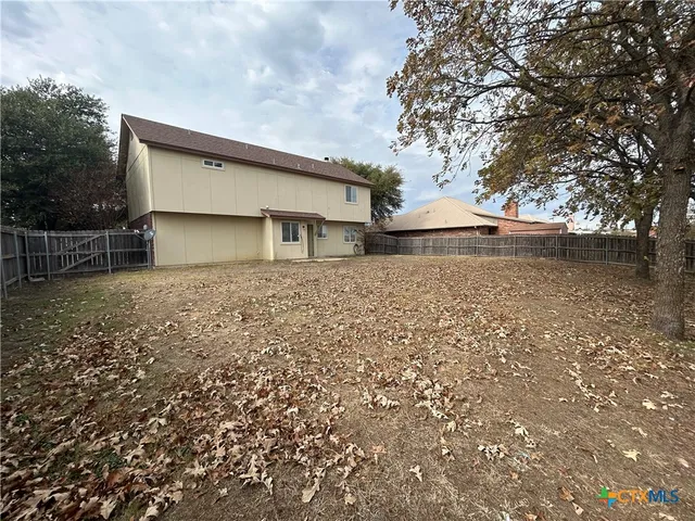 a house with trees in front of it