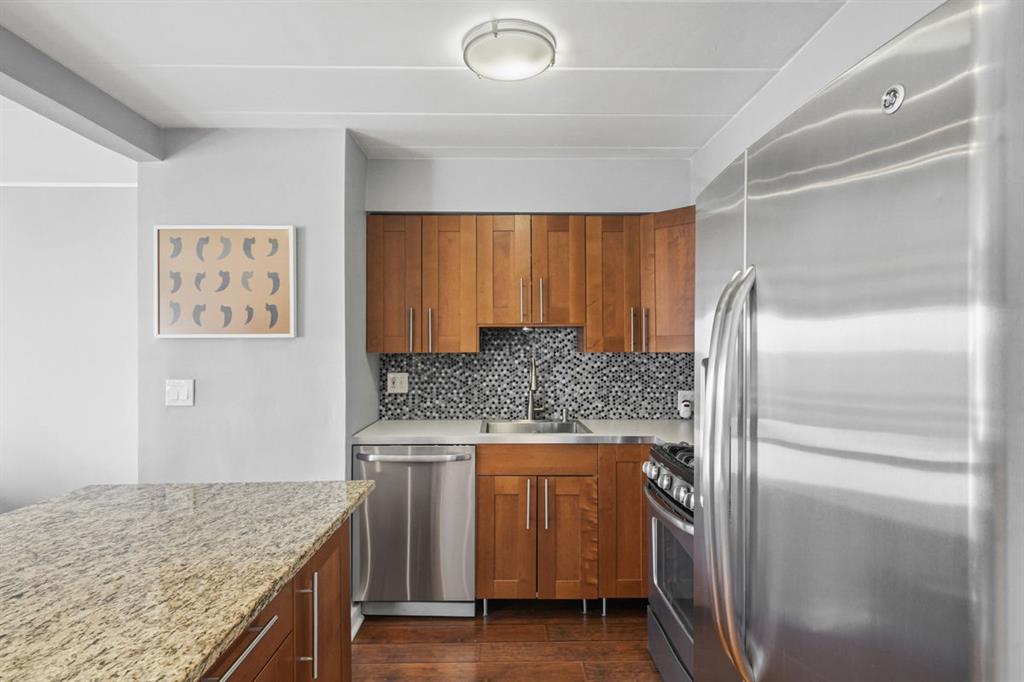 5 Bayard Road, Unit 810 Pittsburgh, PA 15213 - Photo 4 of 43 a kitchen with a refrigerator and countertop