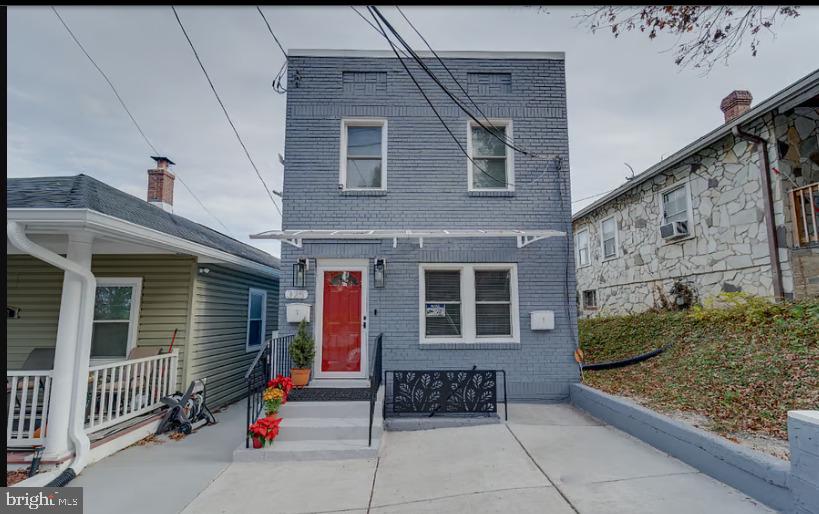 325 57th Street Northeast, Unit 21 Washington, DC 20019 - Photo 1 of 11 a front view of a house with a garage