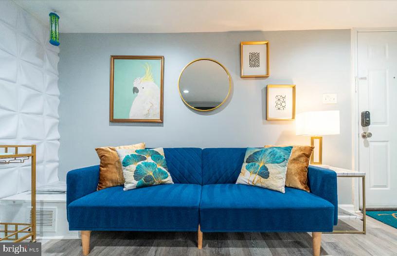 325 57th Street Northeast, Unit 21 Washington, DC 20019 - Photo 2 of 11 a living room with furniture and a mirror