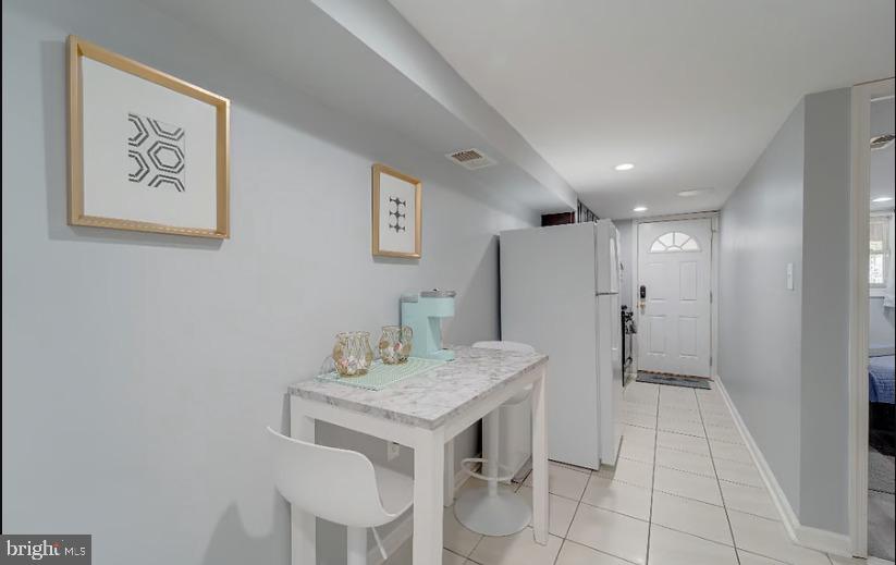 325 57th Street Northeast, Unit 21 Washington, DC 20019 - Photo 4 of 11 a kitchen with a table and chairs