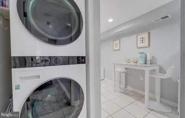 a utility room with sink dryer and washer