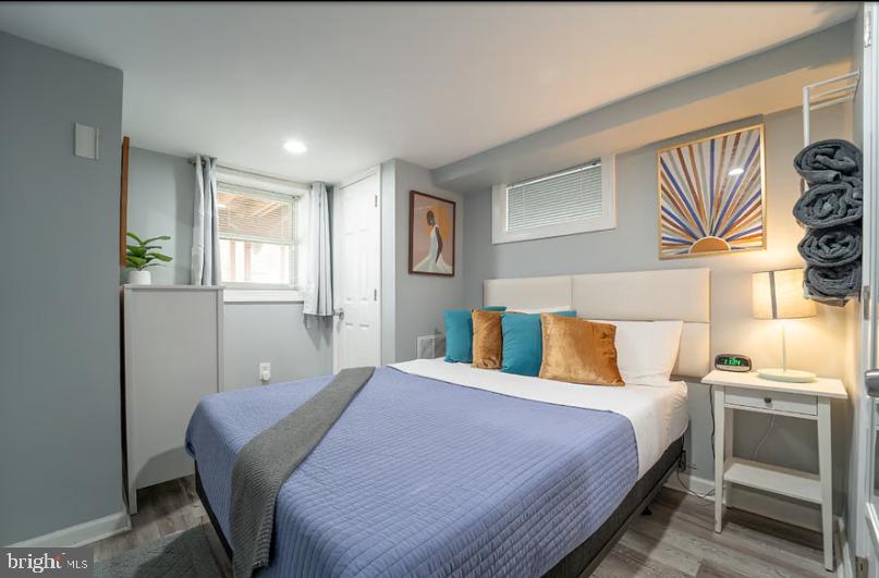 325 57th Street Northeast, Unit 21 Washington, DC 20019 - Photo 7 of 11 a bedroom with a bed and a window