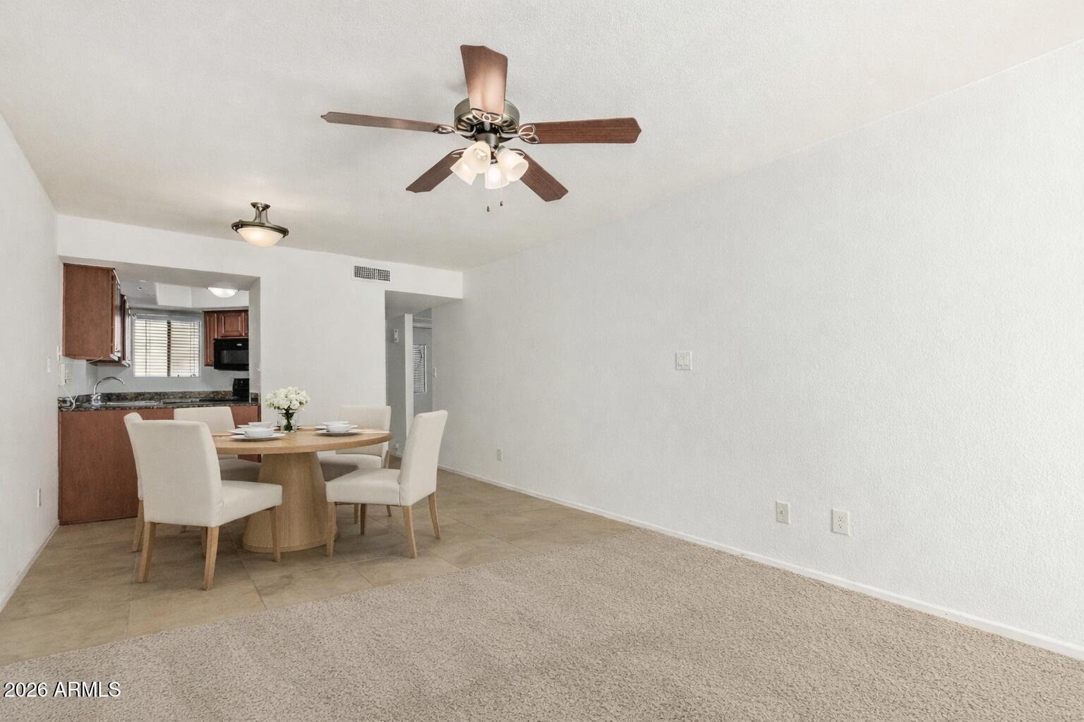 985 North Granite Reef Road, Unit 129 Scottsdale, AZ 85257 - Photo 14 of 38 a view of a dining room with furniture
