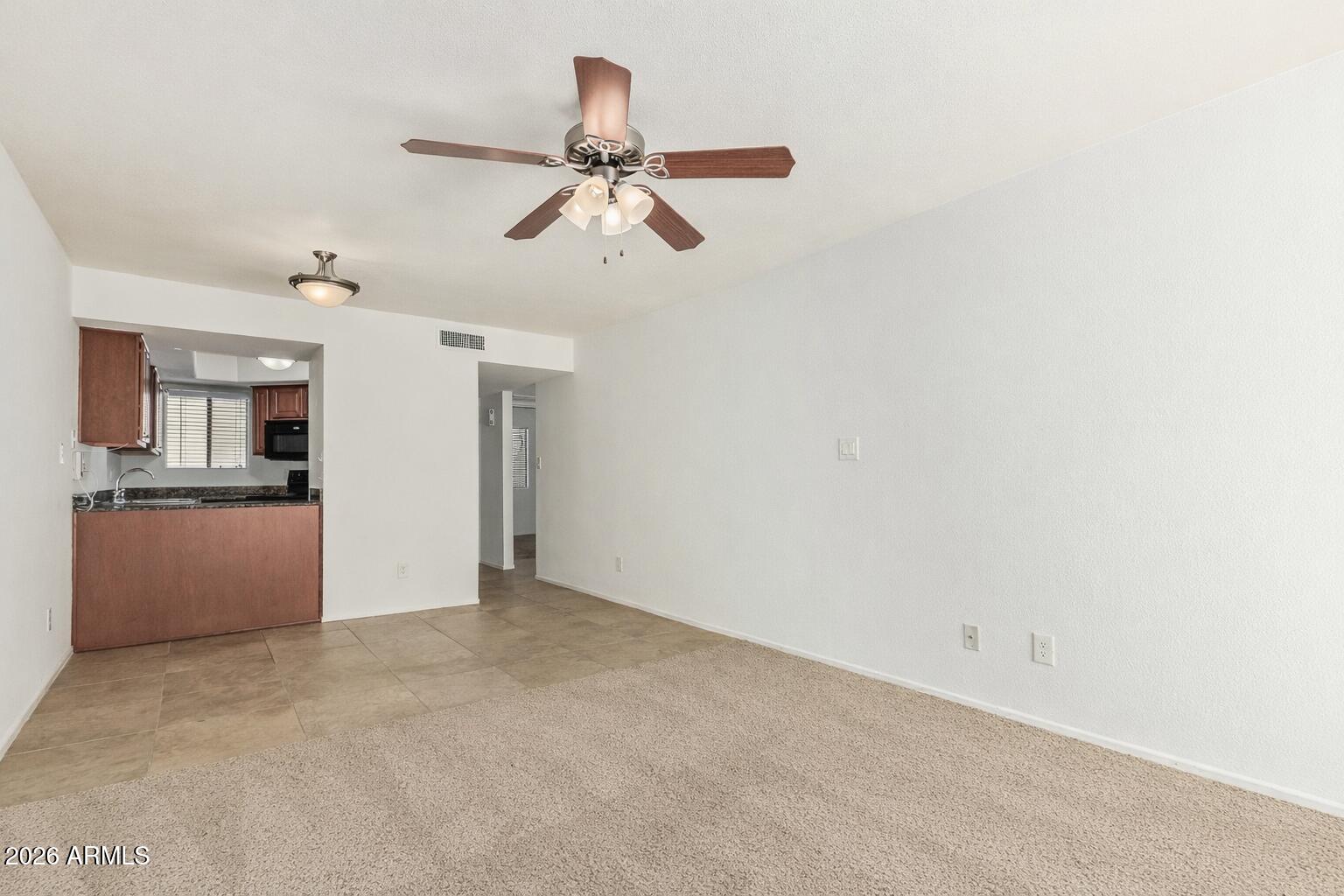 985 North Granite Reef Road, Unit 129 Scottsdale, AZ 85257 - Photo 15 of 38 a view of a kitchen with a sink and cabinet