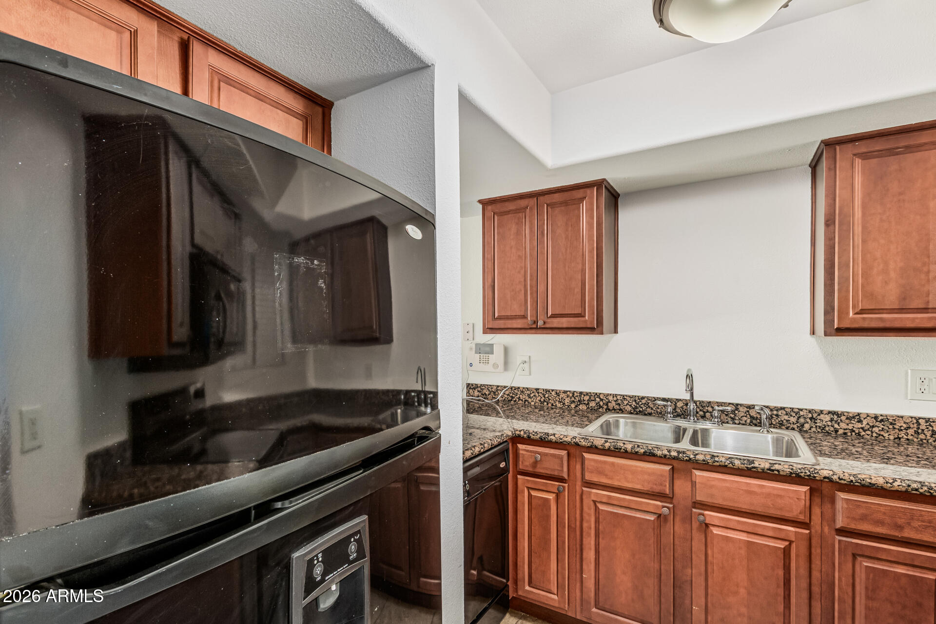 985 North Granite Reef Road, Unit 129 Scottsdale, AZ 85257 - Photo 18 of 38 a kitchen that has a sink and a stove