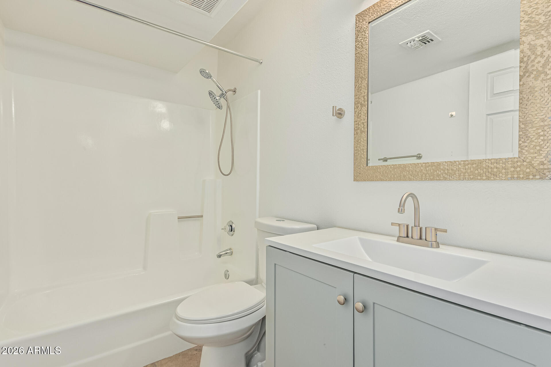 985 North Granite Reef Road, Unit 129 Scottsdale, AZ 85257 - Photo 20 of 38 a bathroom with a sink a toilet and shower