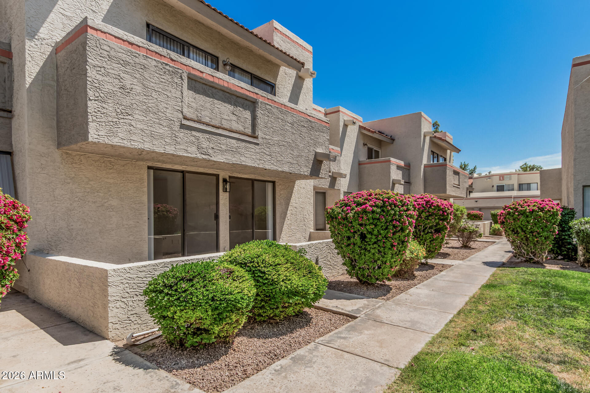 985 North Granite Reef Road, Unit 129 Scottsdale, AZ 85257 - Photo 2 of 38 a view of a house with a garden