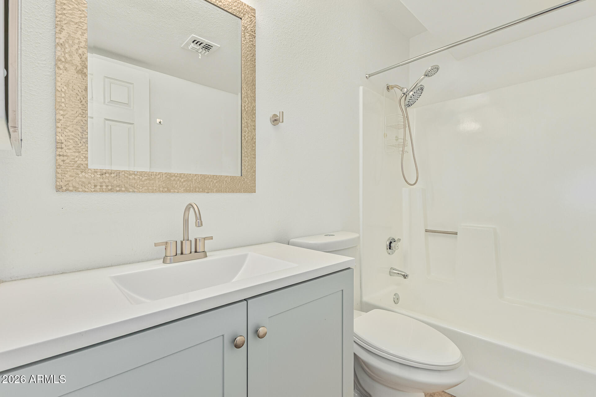985 North Granite Reef Road, Unit 129 Scottsdale, AZ 85257 - Photo 23 of 38 a bathroom with a sink a toilet and shower