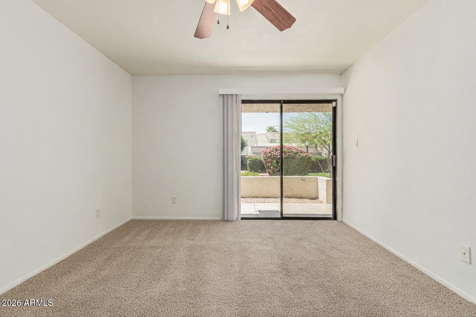 985 North Granite Reef Road, Unit 129 Scottsdale, AZ 85257 - Photo 25 of 38 an empty room with a empty space and a large window