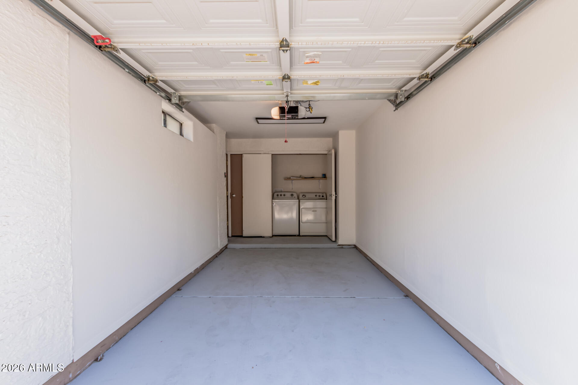 985 North Granite Reef Road, Unit 129 Scottsdale, AZ 85257 - Photo 27 of 38 a view of a hallway with a chandelier