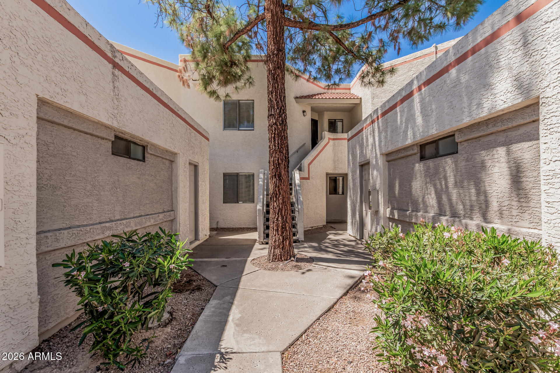 985 North Granite Reef Road, Unit 129 Scottsdale, AZ 85257 - Photo 28 of 38 a front view of a house with garden