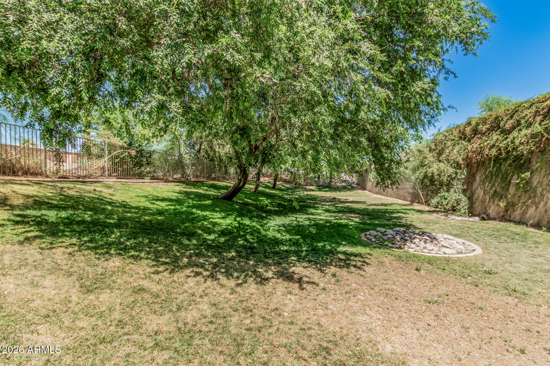 985 North Granite Reef Road, Unit 129 Scottsdale, AZ 85257 - Photo 32 of 38 a big yard with lots of green space and trees