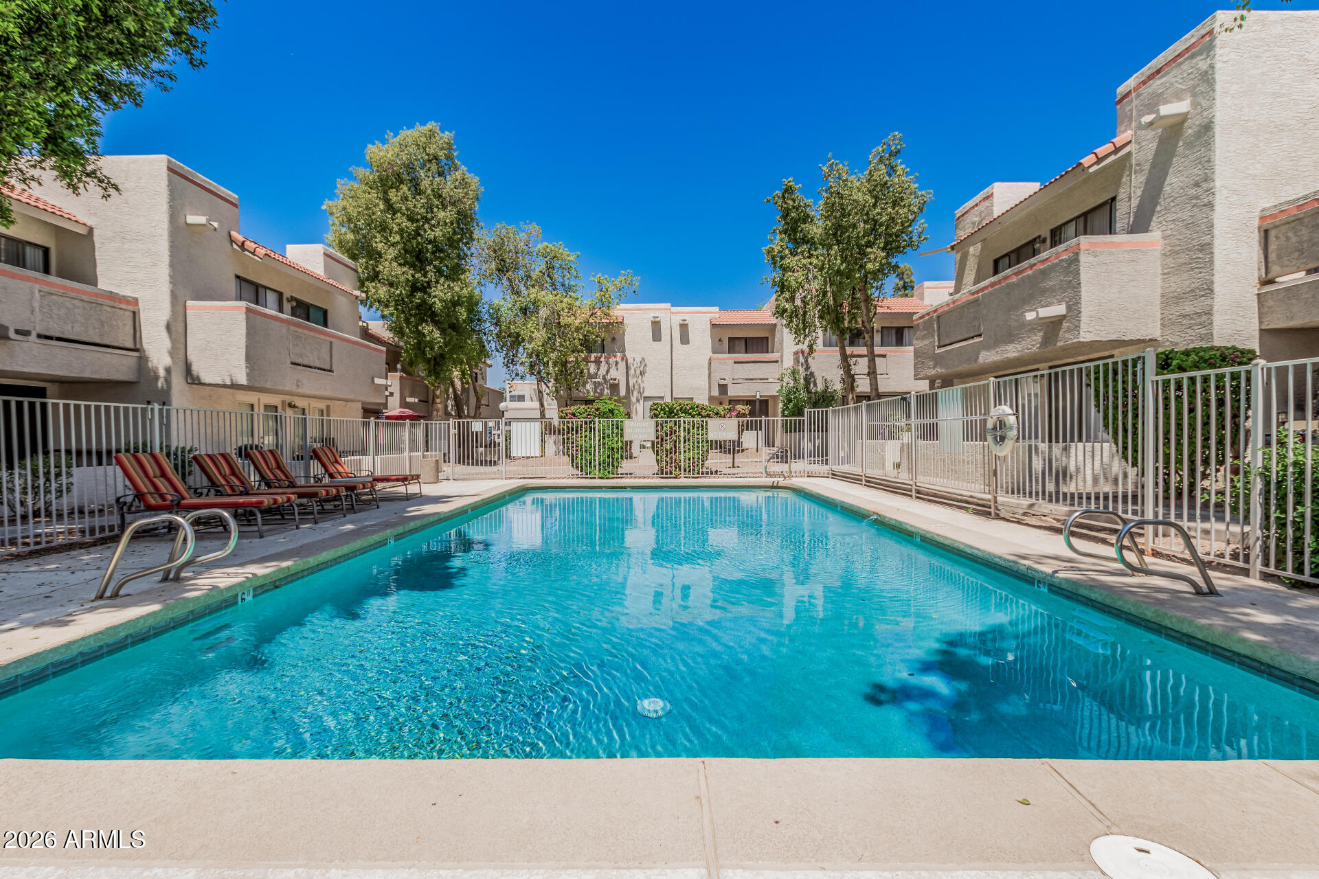 985 North Granite Reef Road, Unit 129 Scottsdale, AZ 85257 - Photo 33 of 38 a swimming pool view with a outdoor seating