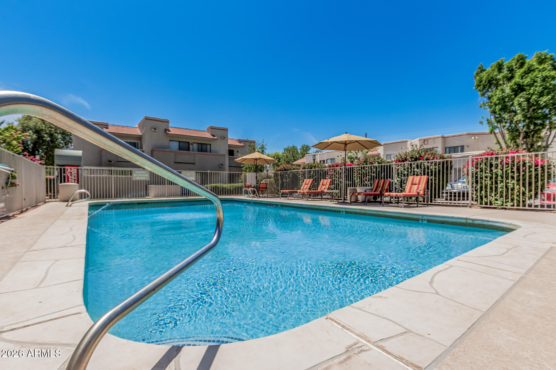 985 North Granite Reef Road, Unit 129 Scottsdale, AZ 85257 - Photo 35 of 38 a view of a balcony with two chairs