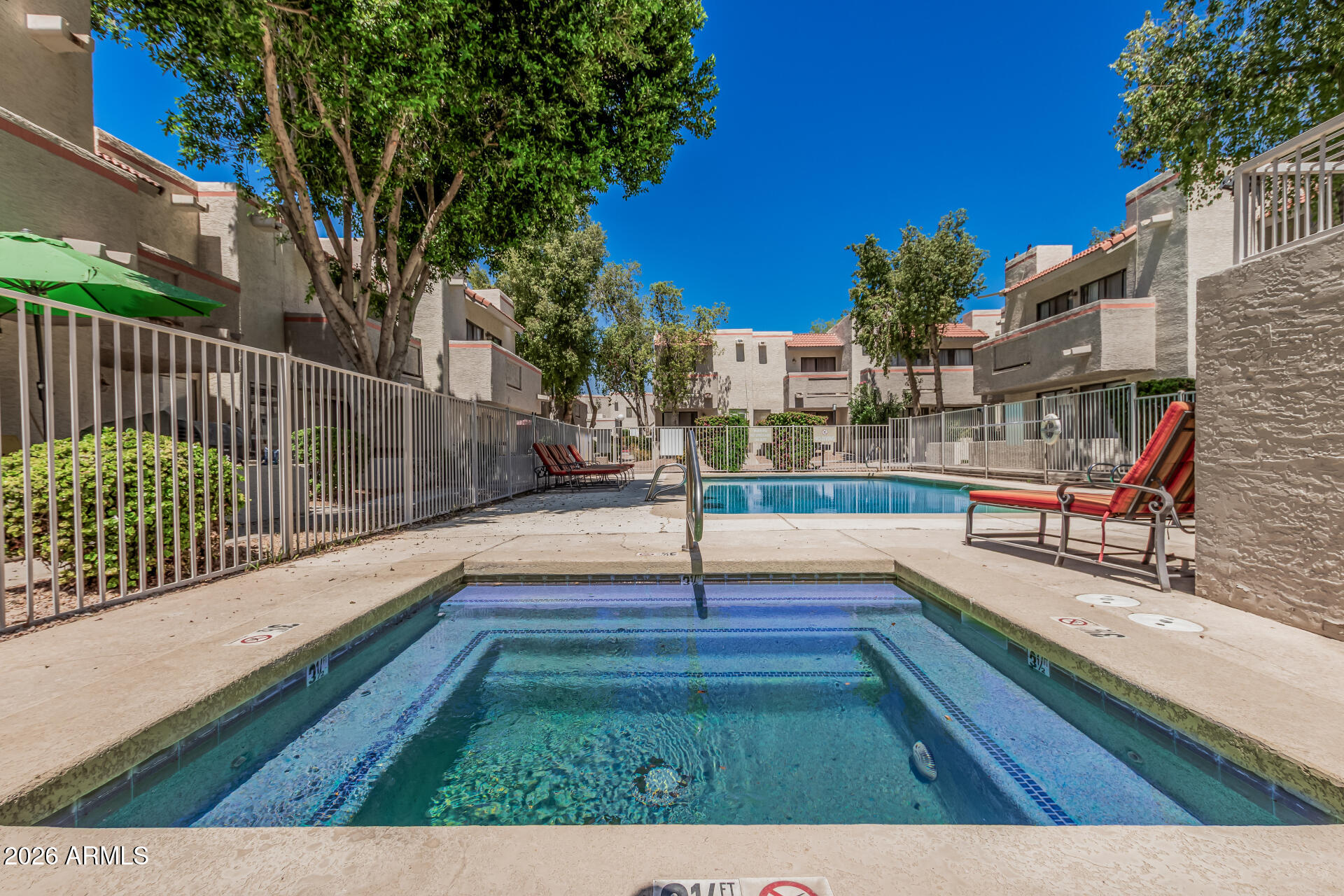 985 North Granite Reef Road, Unit 129 Scottsdale, AZ 85257 - Photo 36 of 38 a view of swimming pool with seating space