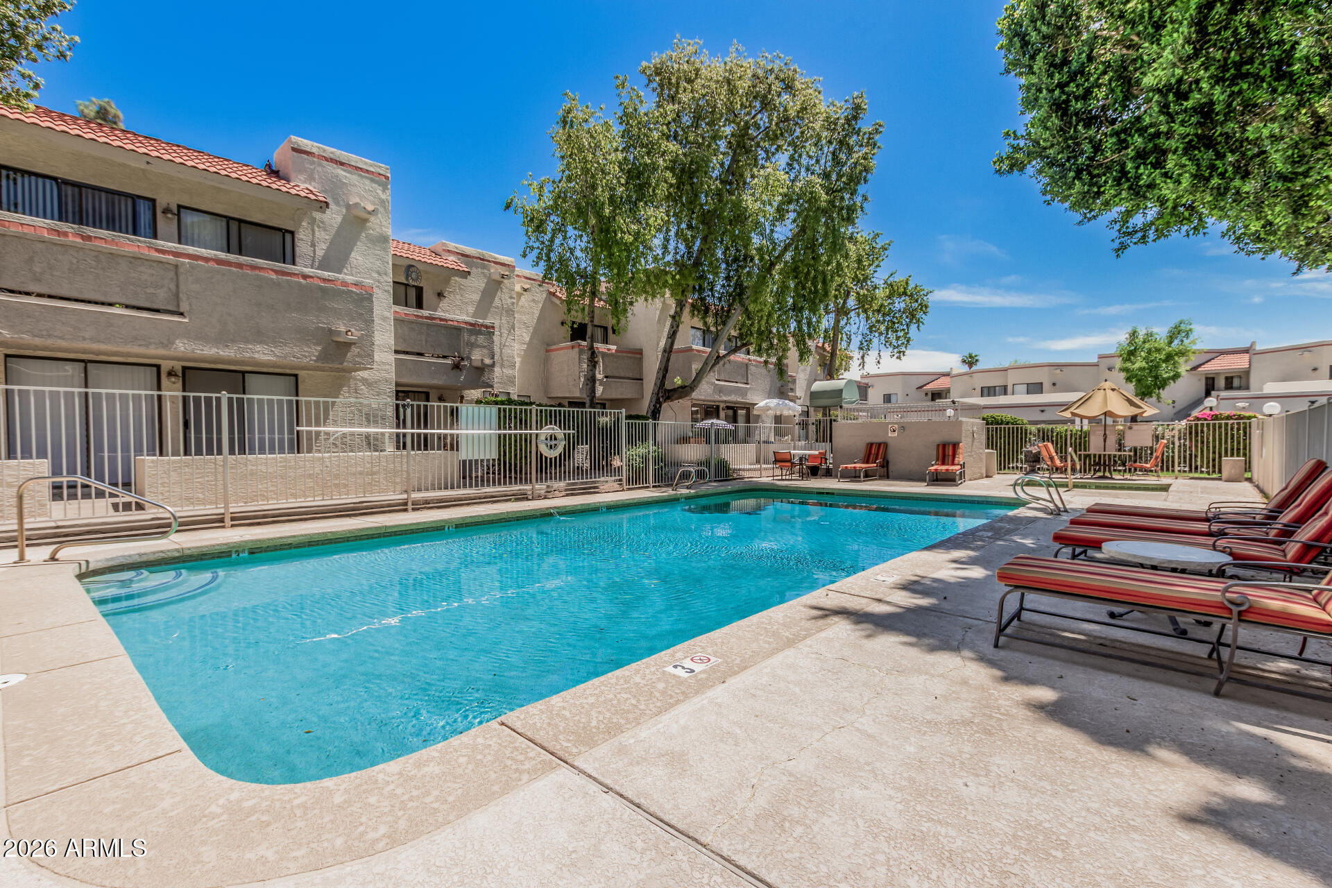 985 North Granite Reef Road, Unit 129 Scottsdale, AZ 85257 - Photo 38 of 38 a view of backyard with swimming pool and seating space