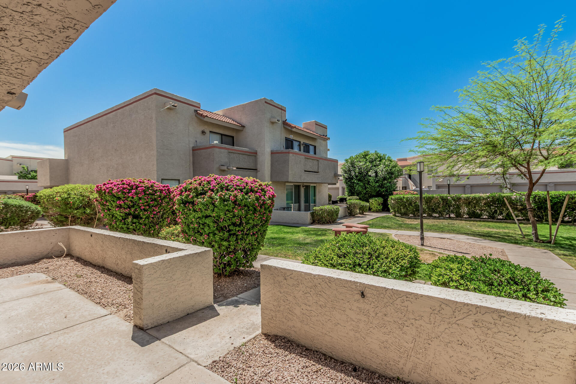 985 North Granite Reef Road, Unit 129 Scottsdale, AZ 85257 - Photo 4 of 38 a view of a garden with a fountain
