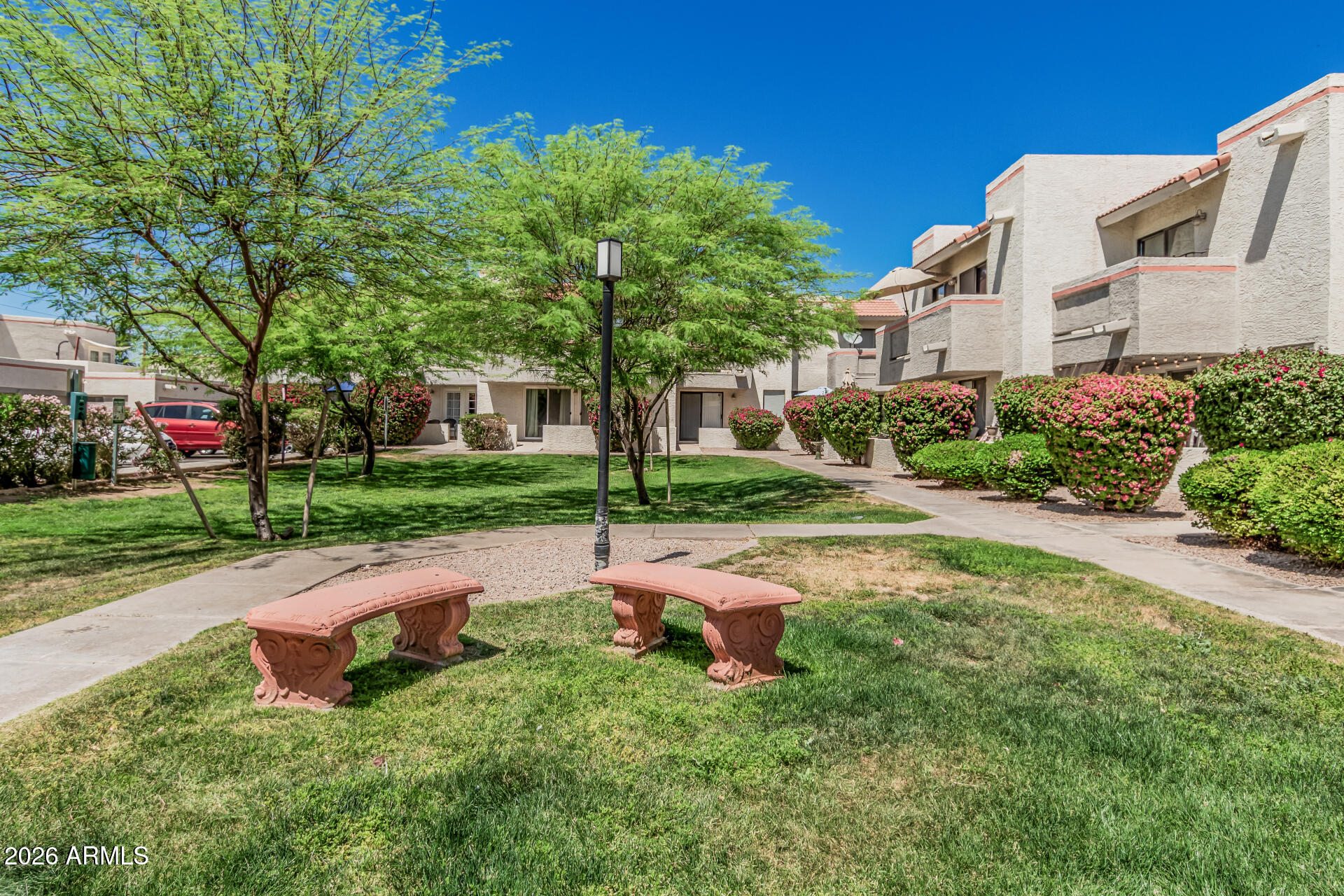 985 North Granite Reef Road, Unit 129 Scottsdale, AZ 85257 - Photo 8 of 38 a view of backyard with a garden and outdoor seating