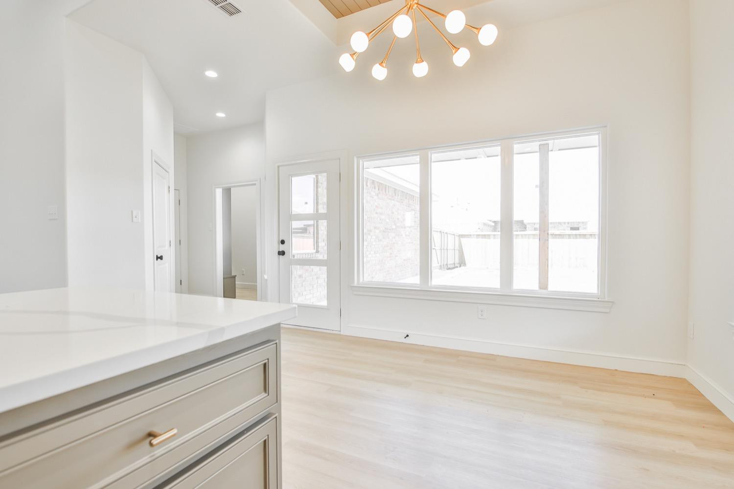 7616 53rd Street Lubbock, TX 79407 - Photo 12 of 50 a view of an empty room with a window