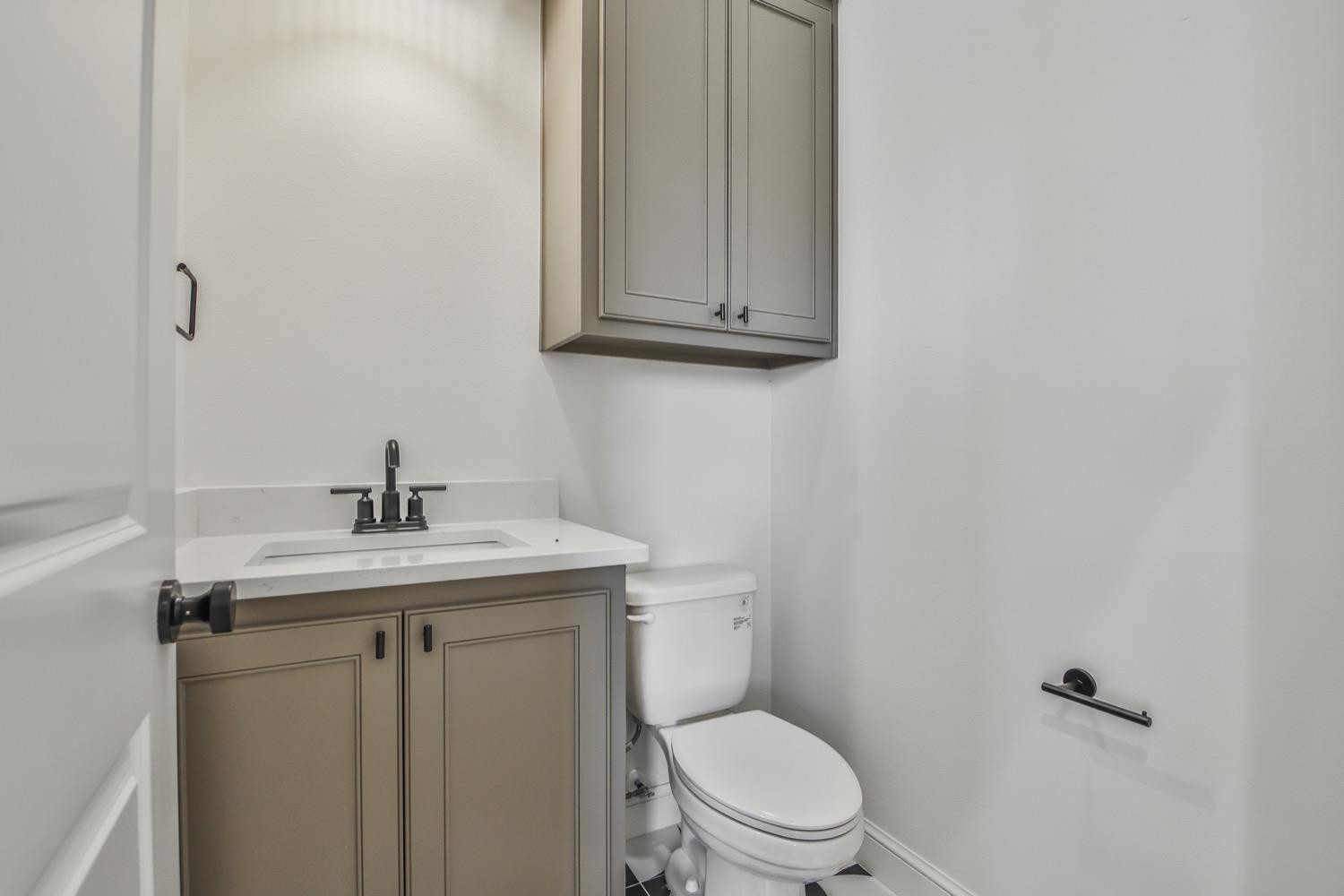 7616 53rd Street Lubbock, TX 79407 - Photo 18 of 50 a bathroom with a toilet sink and mirror