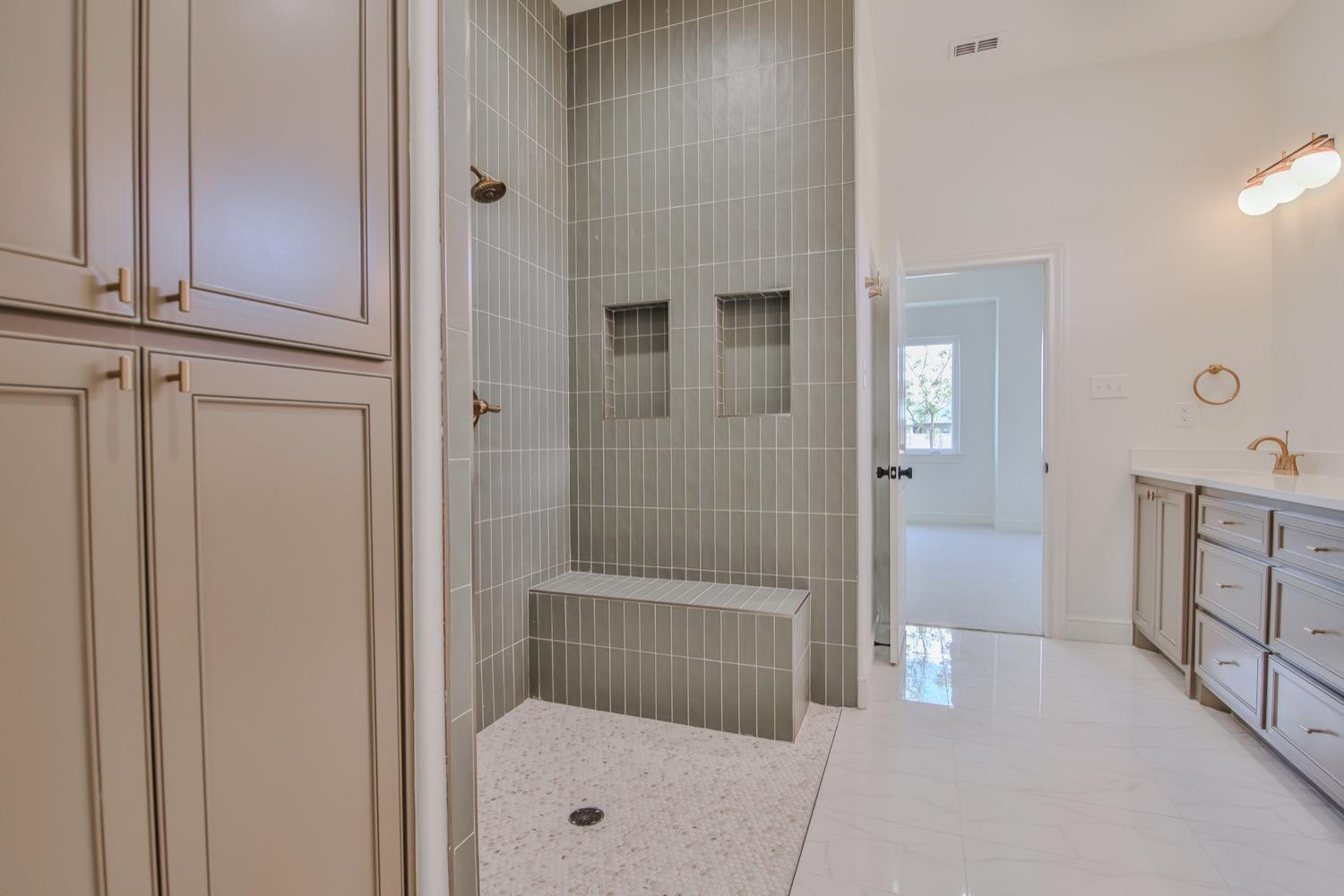 7616 53rd Street Lubbock, TX 79407 - Photo 22 of 50 a bathroom with a shower