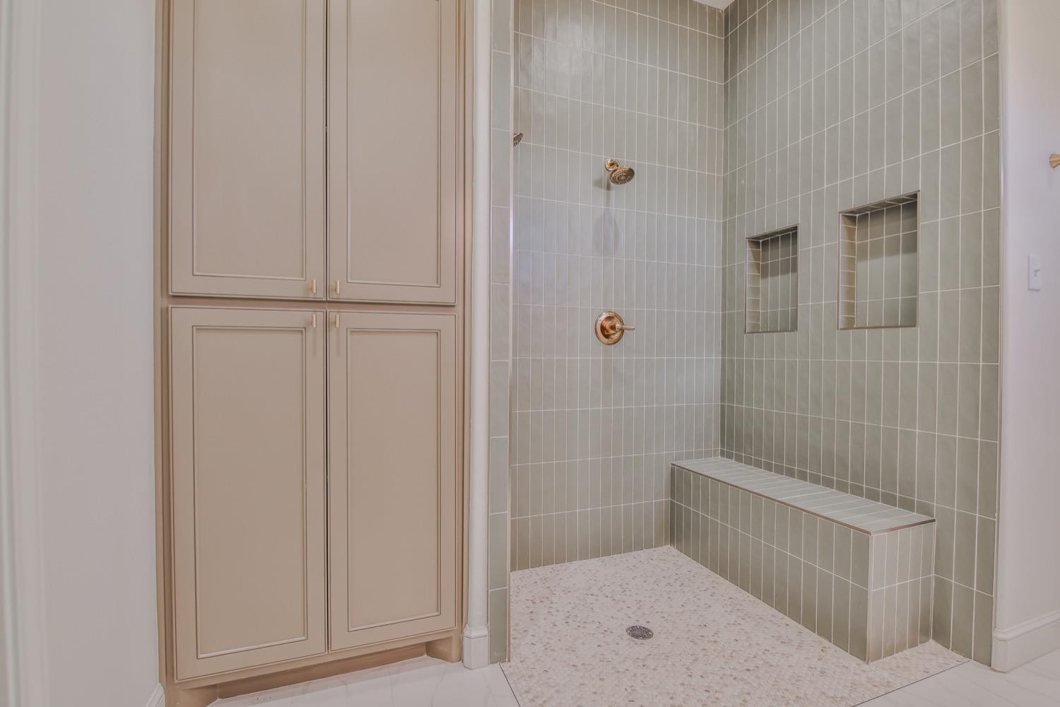 7616 53rd Street Lubbock, TX 79407 - Photo 23 of 50 a bathroom with a shower