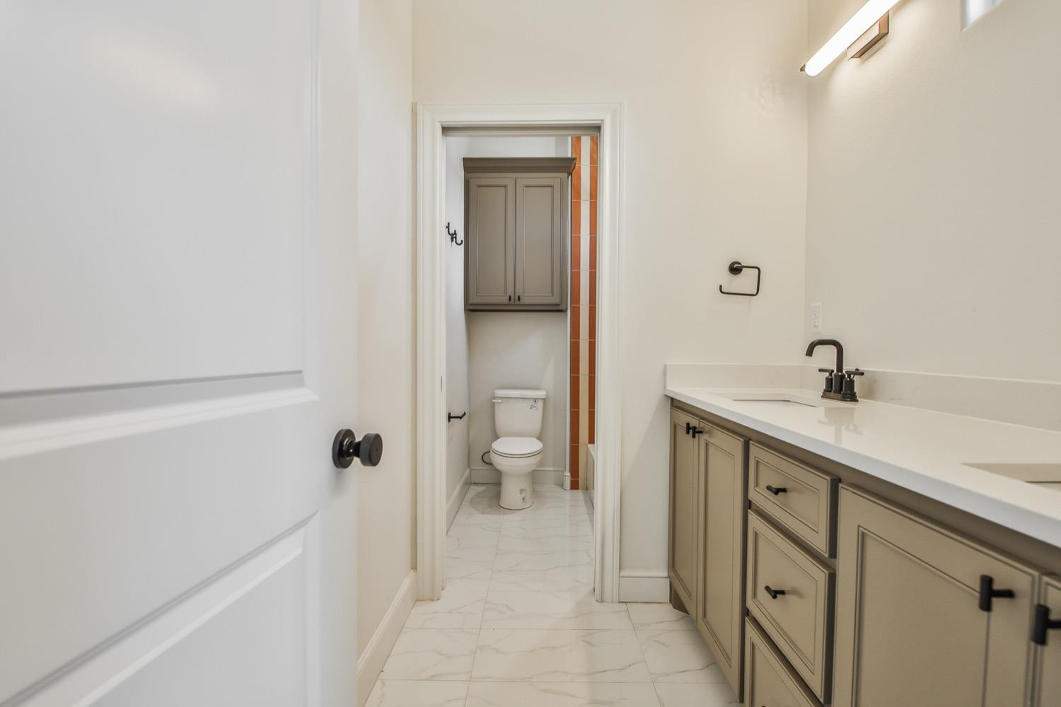 7616 53rd Street Lubbock, TX 79407 - Photo 39 of 50 a spacious bathroom with a sink a toilet and shower