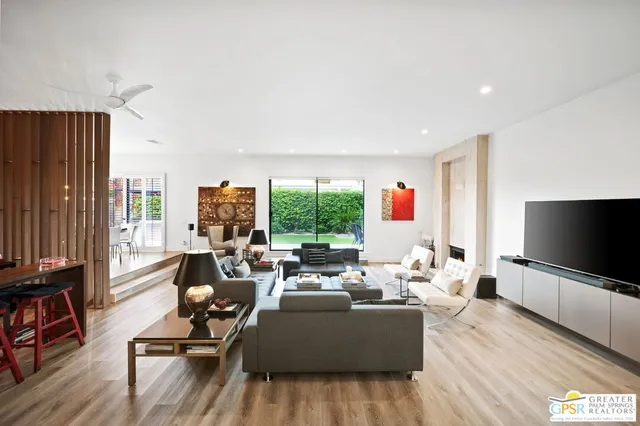 a view of a living room and a floor to ceiling window