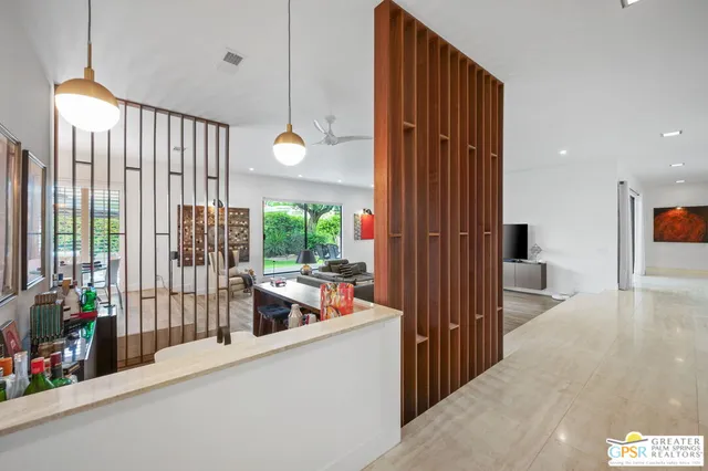 a kitchen with a sink a stove and cabinets