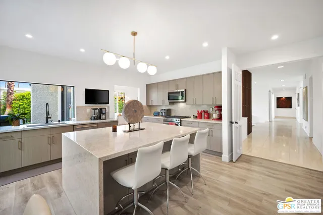 a bed room with a bed window and a flat screen tv