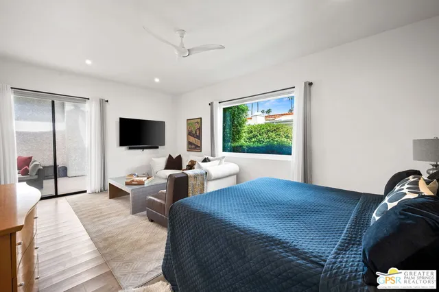 a white bath tub sitting next to a white toilet