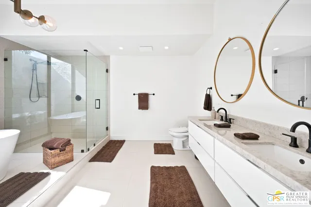a living room with furniture and a flat screen tv with wooden floor