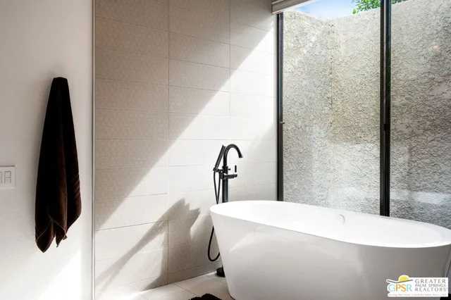 a utility room with sink dryer and washer