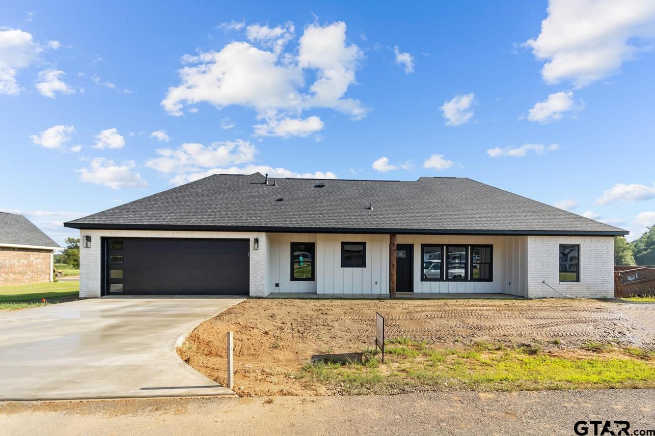 2903 Queens Way West Marshall, TX 75672 - Photo 16 of 17 a front view of a house with a yard