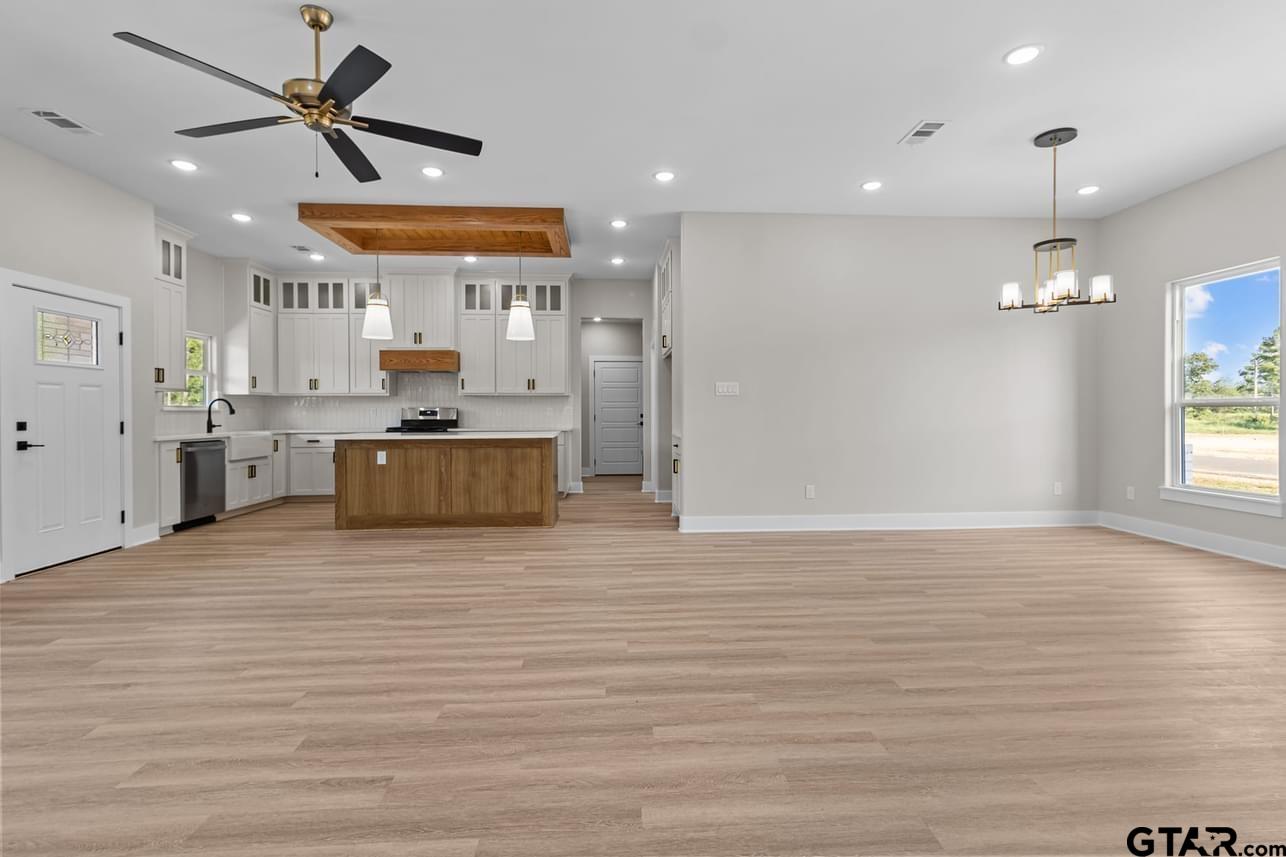 2903 Queens Way West Marshall, TX 75672 - Photo 4 of 17 a large kitchen with stainless steel appliances granite countertop a stove and a refrigerator