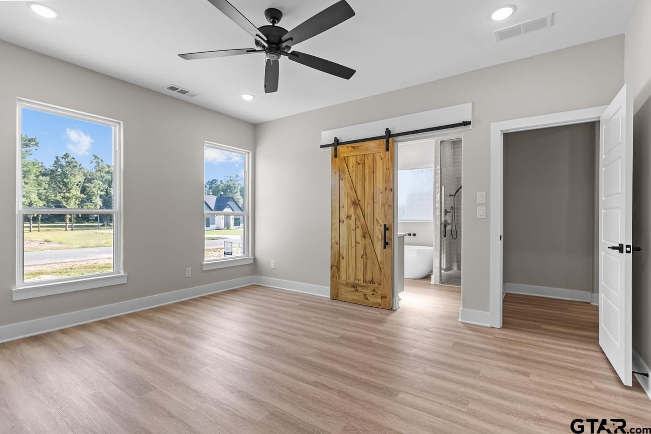 2903 Queens Way West Marshall, TX 75672 - Photo 8 of 17 a view of an empty room with window and wooden floor