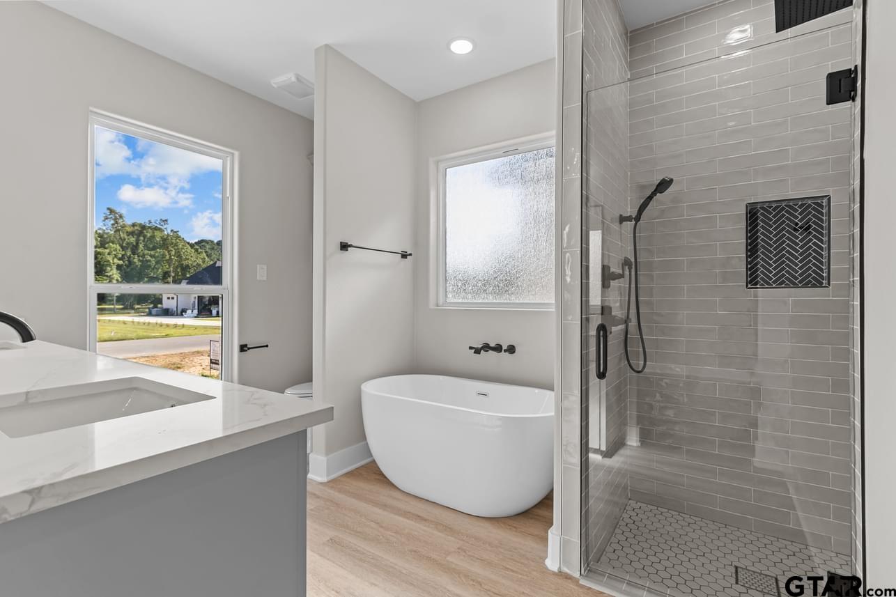 2903 Queens Way West Marshall, TX 75672 - Photo 9 of 17 a spacious bathroom with a bathtub and shower