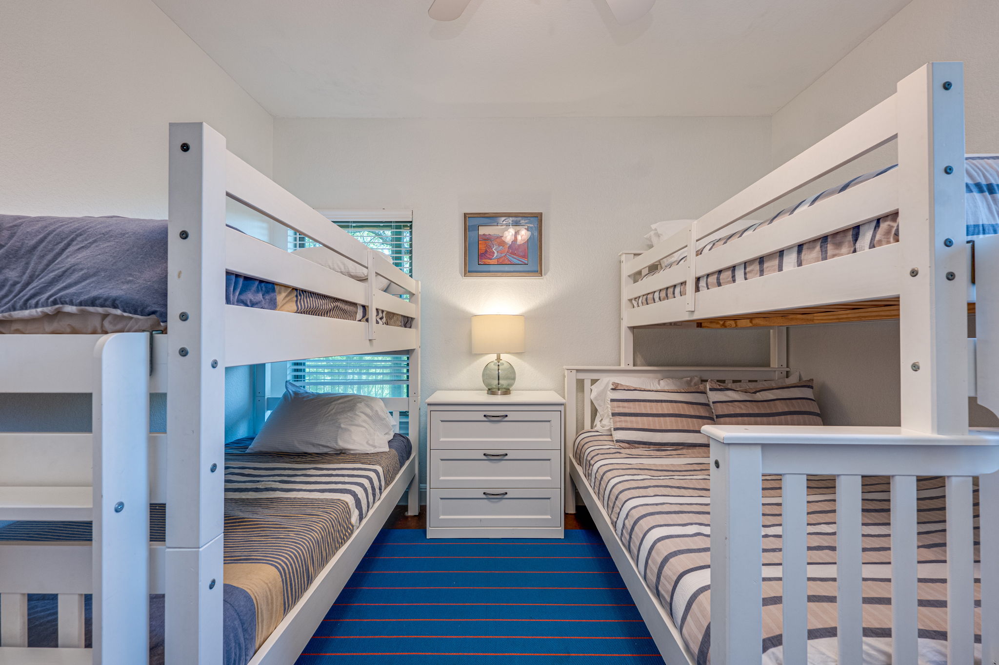 433 Venture Boulevard South Point Venture, TX 78645 - Photo 22 of 36 Set up the room with bunks for the weekend crowd. This lower level bedroom makes room for guests or weekenders.