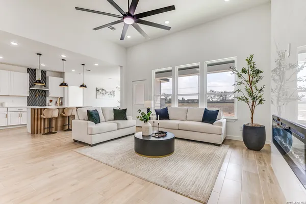 a living room with furniture and a large window